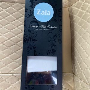 BRAND NEW IN BOX! Zala 24 inch hair extensions! Color is snickerdoodle